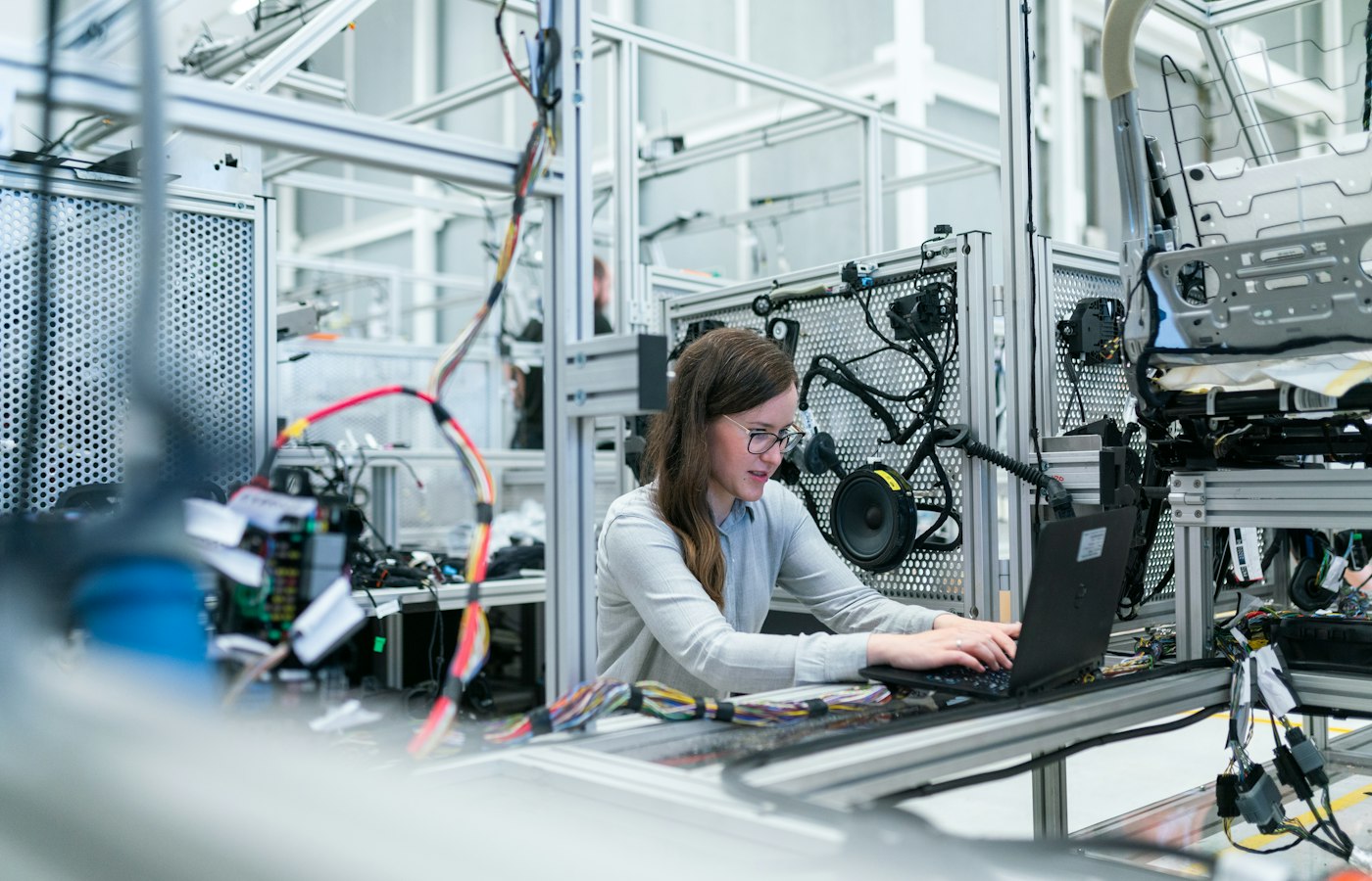 Field engineer using a laptop at a workbench to complete documentation
